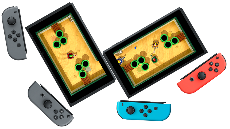 An official photo showing how one of Super Mario Party’s two-screen games can be played. Players can drive tanks from one screen into the next.